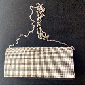 Brand new black evening bag with front silver glitters 8” by 4”